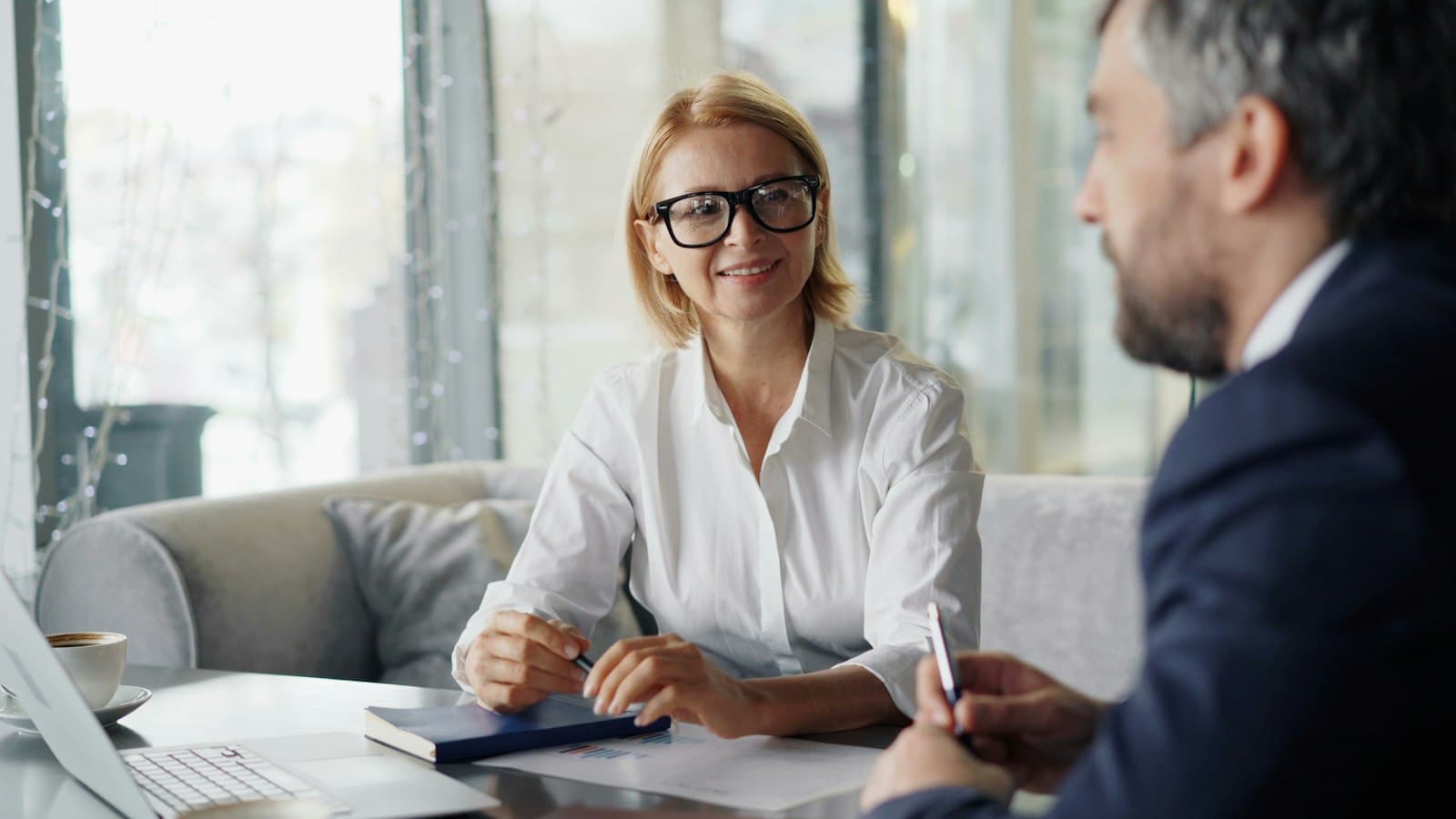 A loan officer meeting with a client